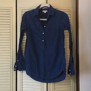 Long sleeve denim colored blouse.